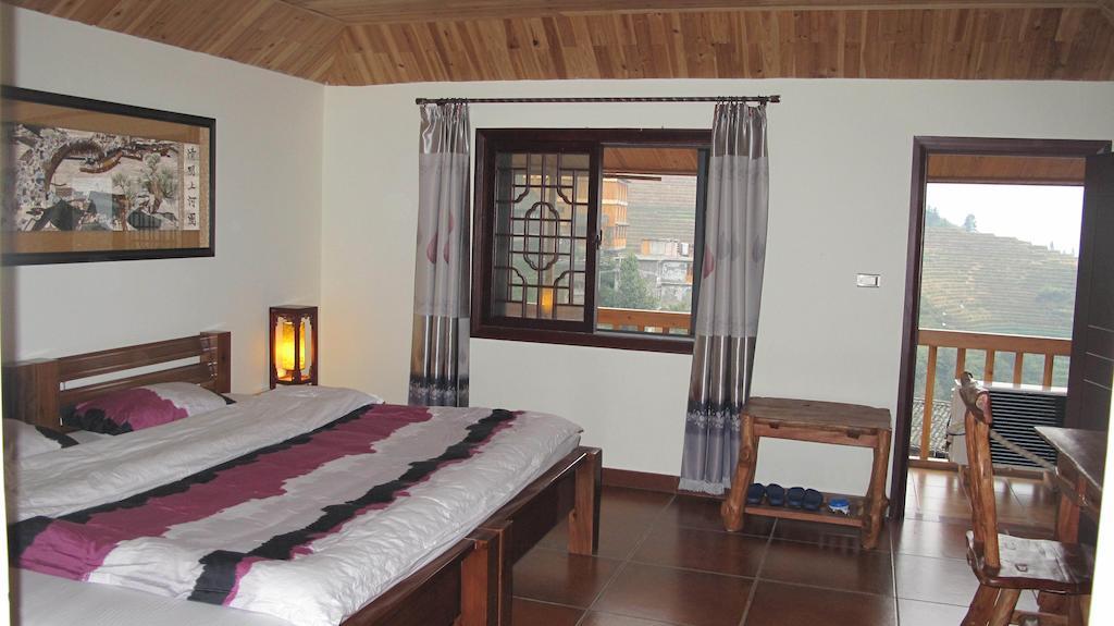 Longji Holiday Hotel Longsheng Rom bilde